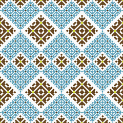 Classic seamless vector pattern with intricate geometric and floral motifs in blue, brown, and yellow on white. Perfect for textile design, wallpaper, interior decor, and craft projects.