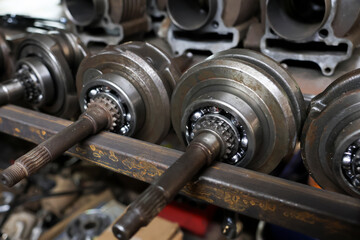 Selective focus of many car crankshafts, motorcycles, used spare parts, closeup of car crankshafts,...