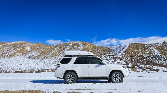 Driving car at zanda Tulin National Geological Park in tibet, China