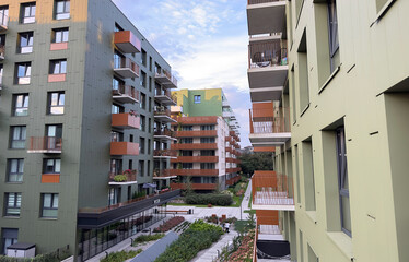 A row of apartment buildings with balconies.