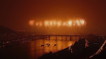 Fototapeta premium Panoramic view capturing a city celebration with bridge and fireworks