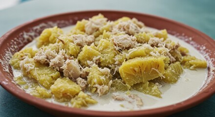 Serving Jackfruit Dish in Creamy Sauce Garnished with Coconut Flakes