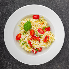 Pasta with tomatoes vermicelli vegetables dish fresh delicious gourmet food background on the table rustic food top view copy space