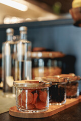 the modern glass jar with dried apricot and raisin at hotel breakfast