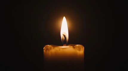 Elegant Flame Lighting Up a Candle in a Dark Room Atmosphere