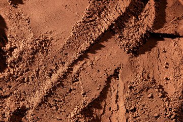 Natural dark brown cocoa powder textured background, closeup, top view
