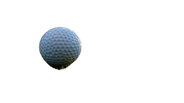 Golf Ball on Green: A single golf ball, perfectly poised on a patch of green grass, ready for the next shot, embodying the precision and focus of the game.