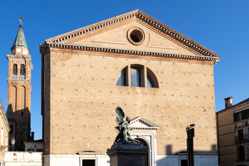 Facade of the Minor Basilica of San Giacomo Apostolo with the Monument to the Fallen in Chioggia,...