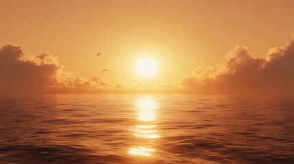 Golden sunset over the tranquil ocean with birds in flight.