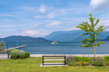Mountain Lake Seawalk with Blue Sky and White Clouds in British Columbia, Canada.