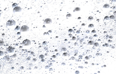 Abstract background of silver bubbles on white. Perfect for cosmetics, beauty, or spa.