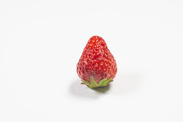 Red fresh whole strawberry isolated in white