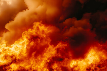 Obraz premium Fiery inferno, intense flames and smoke billowing, abstract fiery texture background.