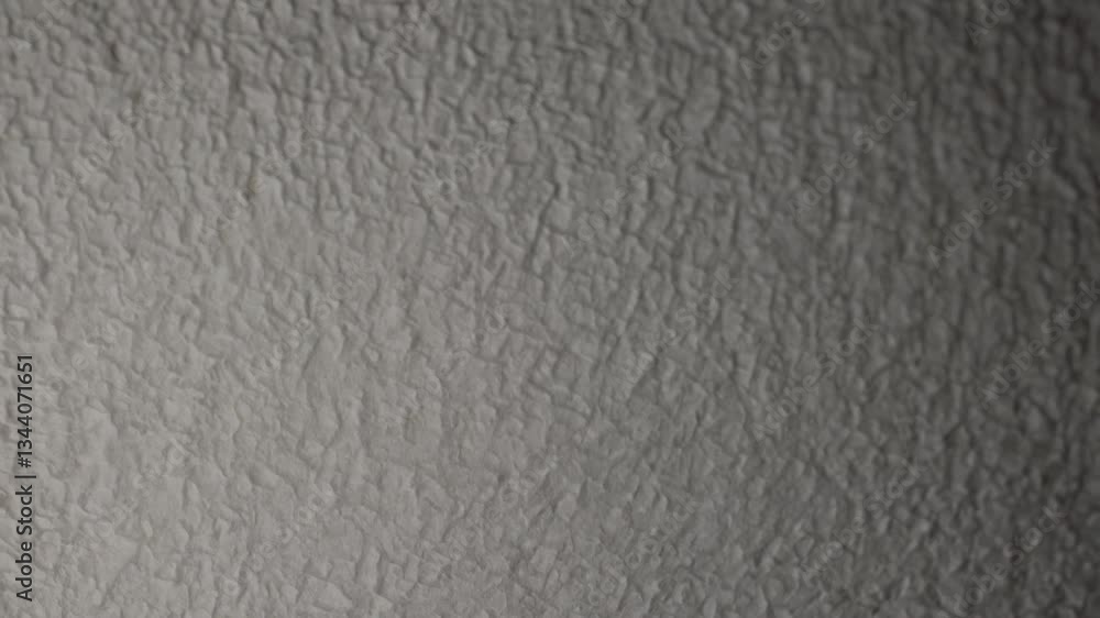 Poster detailed close-up of a textured gray surface with a crinkled appearance, showcasing the intricacies 