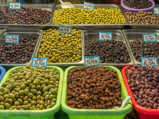 Various types of olives for sale at the central municipal market in Athens, Greece