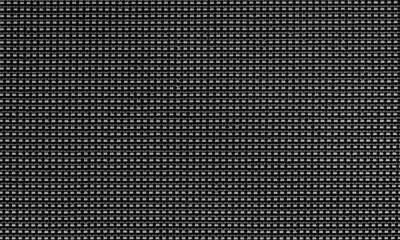 Black textured background with a grid-like woven pattern and high contrast details