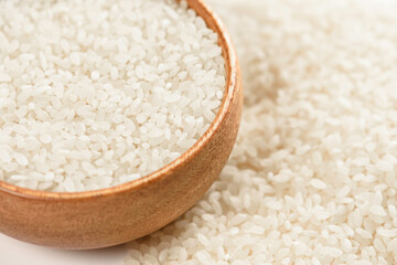 Raw rice in bowl. Purity and naturalness of the product in healthy diet.