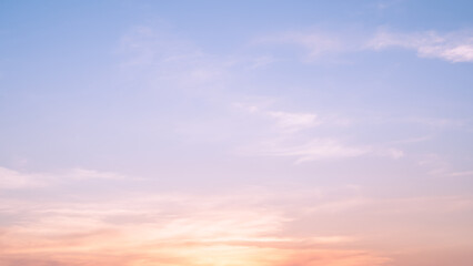 Blue, pink, yellow pastel sky. The wind blows the soft sunset  clouds. Nature banner background.