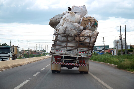 Load securing and traffic hazards. An overloaded truck on a federal highway. The freight of heavy plastic bags was tilted and inadequately secured. Mossoro, Rio Grande do Norte State, Brazil.