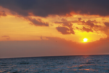 Indian Beautiful orange sunrise, blue sea   
