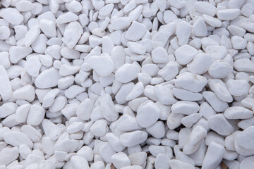 Pebbles on the ground as an abstract background. Texture. Granite 