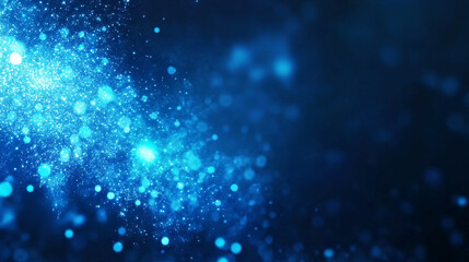 Blue glowing particles on dark background
