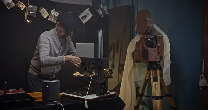 Vintage Photographer Working in Film Development Darkroom