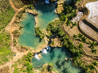 Southwest Sumba, East Nusa Tenggara , Indonesia – 05 . 29. 2024 – The beauty of Wee Kacura Waterfall surrounded by a thousand hectares of rice fields