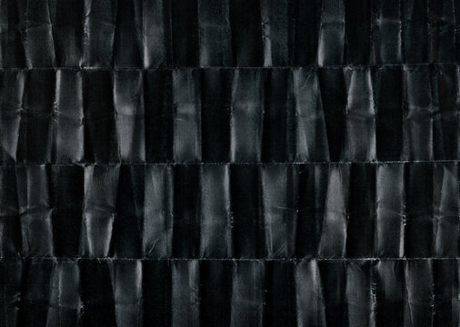 scan of dark paper with many folding marks. cool print overlay.