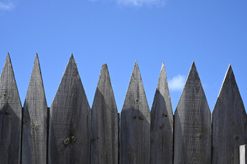 wooden barrier against blue sky