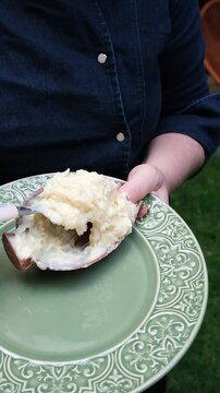 Confectioner showing the creaminess of the coconut fudge filling_vertical.