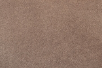 Genuine leather texture close up. Brown leather texture with smooth and natural grain pattern. Elegant natural background for fashion, upholstery designs