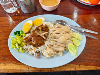 Stewed Pork Leg with Rice served alongside Hainanese Chicken Rice.
