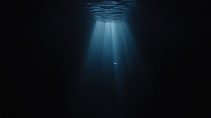 Obraz premium Submerged light beams in dark abyss