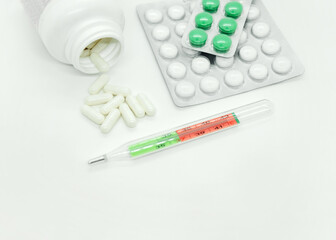 Medical Supplies with Pills Capsules and Thermometer