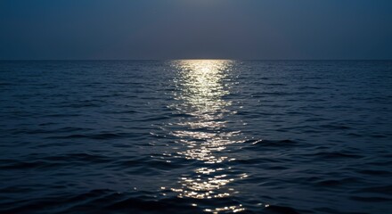 Obraz premium Serene Moonlight on Dark Ocean Water Glimmering Reflections Night Sea