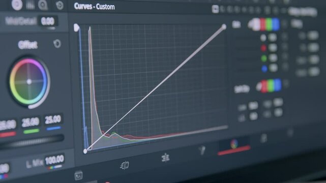 Colorization curves. Color grading indicator. Video colorization program. Post-production color correction in progress. Close-up of computer monitor. Filmmaker colorist edits commercial films