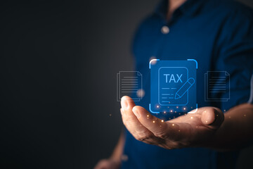 A businessman presents a futuristic digital tax document interface with glowing icons, symbolizing online tax filing, financial management, electronic taxation, and secure digital transactions.