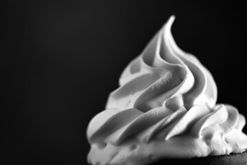 Whipped cream on black coffee with high contrast and negative space