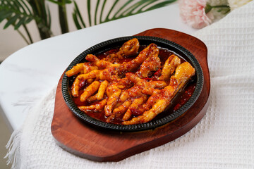 Tiger skin chicken feet on white background
