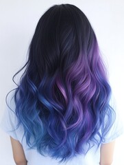 Naklejka premium Long Wavy Hair with Dark Roots Fading into Purple and Blue Ombre Color