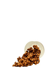 Kue Tambang or Untir untir is a traditional Indonesian cookies made from wheat flour, sugar, eggs, and chocolate. Served crystal bowl, isolated on white background