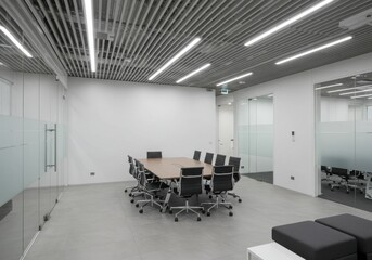 A modern office space featuring sleek design with horizontal lines on the ceiling glass partitions and a welllit conference area with dark chairs