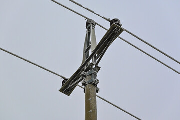 A pole of a low-voltage power line that is covered with frost