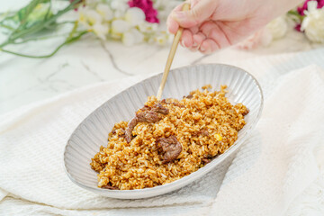 Beef fried rice on a simple background