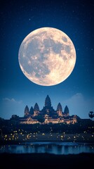 Naklejka premium Majestic Angkor Wat Temple Under a Full Moon Cambodia Night Photography Serene Landscape Wide Angle Historical Wonder