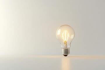 A glowing incandescent light bulb, symbolizing ideas, innovation, and inspiration.