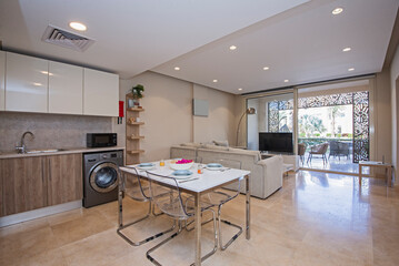 Interior design of luxury apartment living room and kitchen with patio