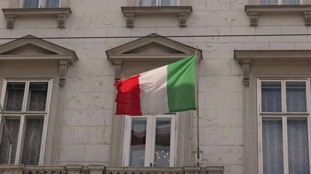 Italian flag on a building in Europe.