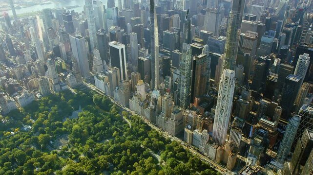 Aerial View Of  Manhattan Skyscrapers revealing beautiful Central Park, Midtown Skyline. Billionaires Row in 57th and 59th street. New York City.  High Quality Content Shot from Helicopter.